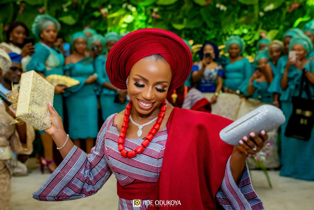 Kemi the bride smiling and holding a Bible