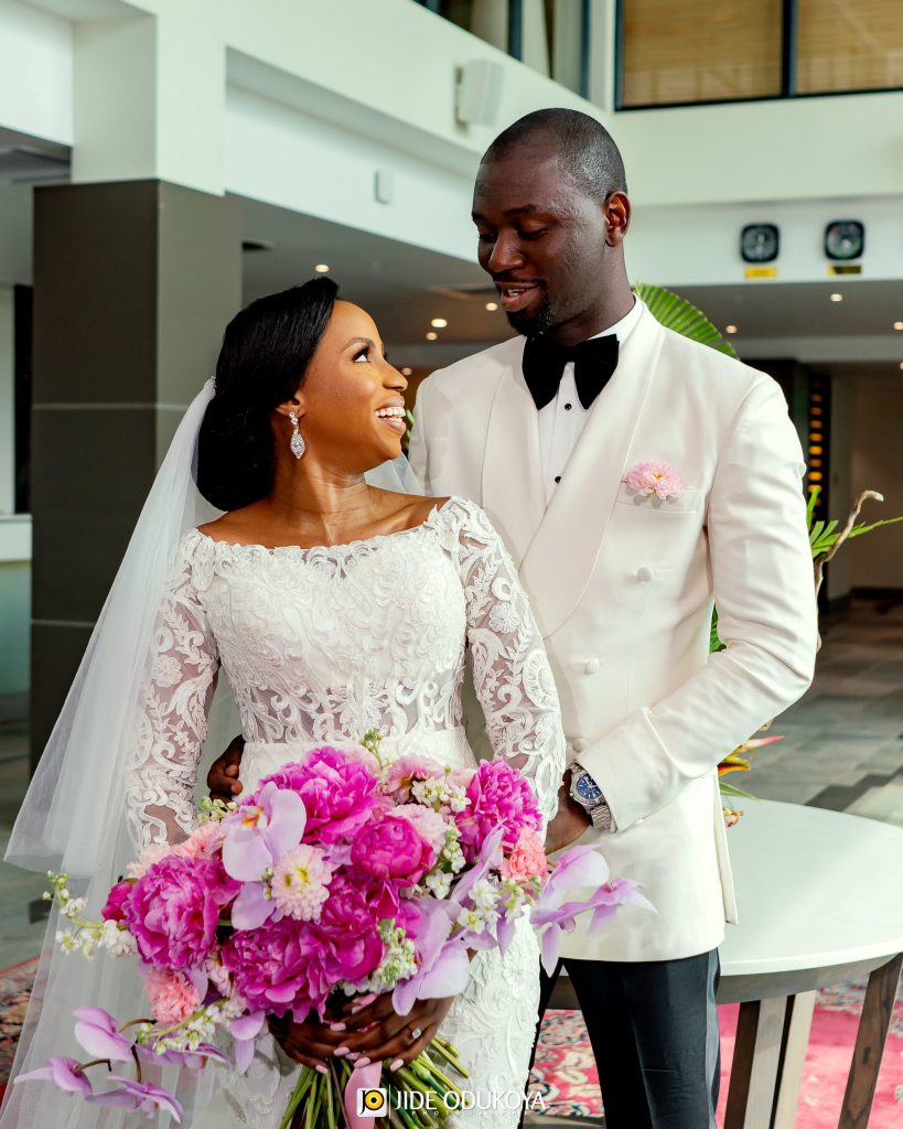 Kemi the bride and Pelu the groom looking into each other's eyes