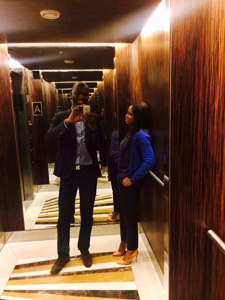 Kemi and Pelu taking a selfie in an elevator
